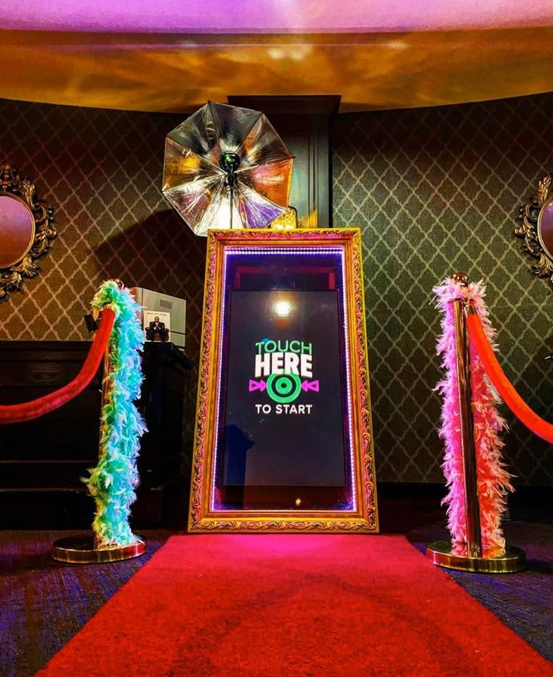 Our full-length Magic Mirror booth set up with a touch screen and red carpet